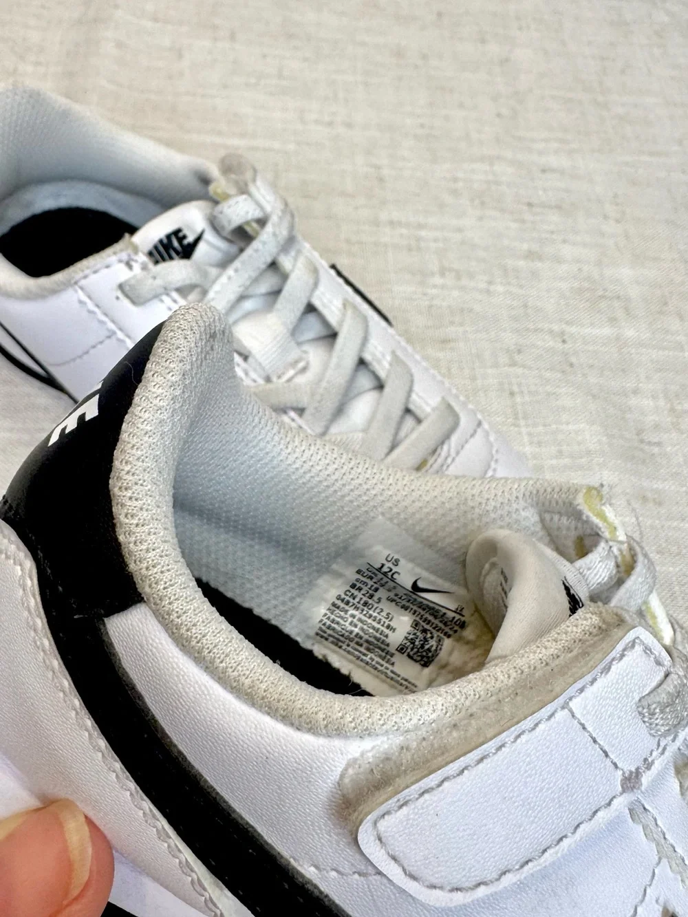 Nike Kids White Sneakers with Black Swoosh